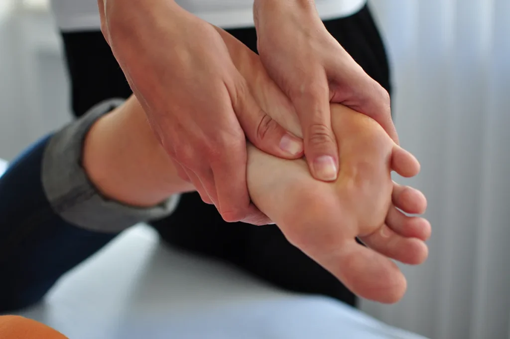 receiving a foot massage indoors
